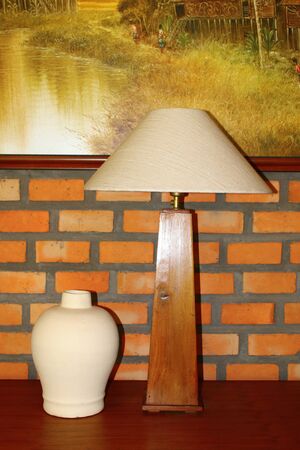 Table lamp and flower vasの写真素材