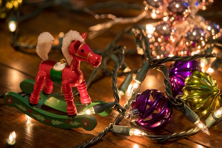 ornaments and christmas lights on wood floorの写真素材