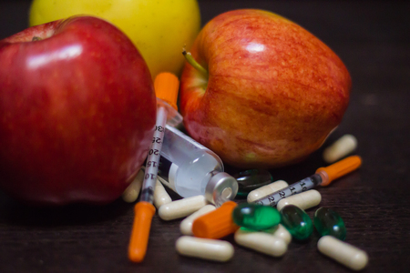 pills syringes and applesの写真素材