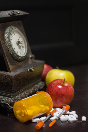 medications piled aroud clockの写真素材