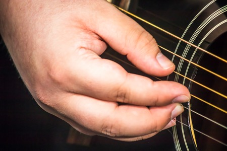 close up of guitarists hand