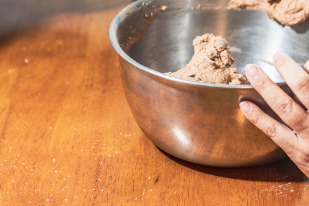 steel bowl with chocolate frostingの写真素材