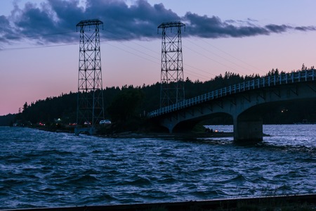 sunset above choppy waterの写真素材