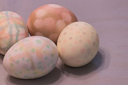 four multicolored polkadot eggs dyed for easter