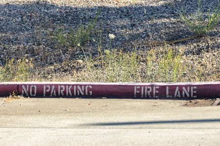 fire lane with dirt gravel area behind it