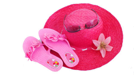 Beach pink hat and slippers on white backgroundの写真素材