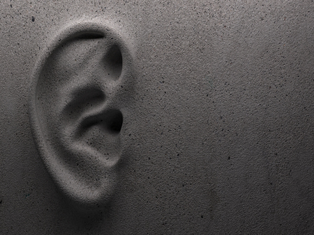 Ear on wall concept
