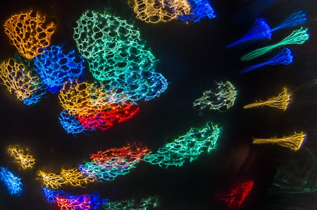 colorful smoke splashes on dark abstract background