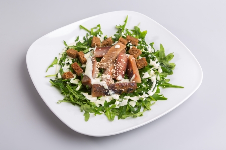 Salad with herring and arugulaの写真素材