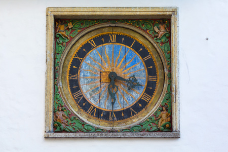 Clock face on the wall of the Church of the Holy Spirit in the old town in Tallinn in Estonia in...