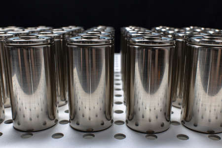 A pack of new modern high-capacity lithium-ion cells. A prototype of new batteries on a laboratory table.の写真素材