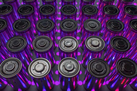 A pack of new modern high-capacity lithium-ion cells. A prototype of new batteries on a laboratory table with UV light.の写真素材