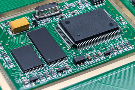 Details of electronic board. Close-up of electronic circuit board with SMD components and chipsの写真素材