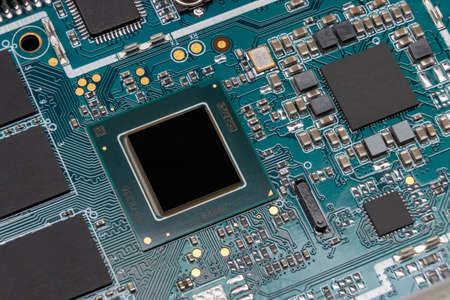 Detail of electronic board of computer. Close-up of electronic circuit board with chipset, microchips and SMD componentsの写真素材