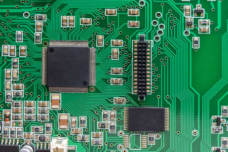 Top view of electronic circuit board with microchips, controllers, connector and smd componentsの写真素材