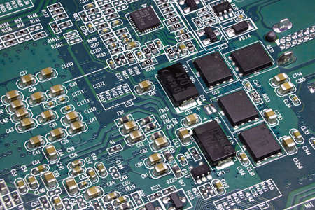 Details of electronic board. Close-up of electronic circuit board with SMD components, microcircuits...