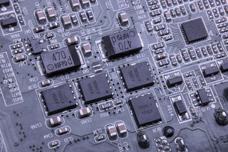 Details of electronic board. Close-up of electronic circuit board with SMD components, microcircuits and chipsの写真素材