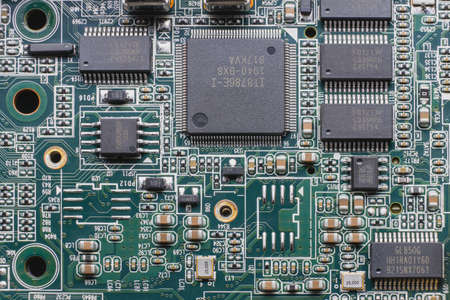 Details of electronic board. Close-up of electronic circuit board with SMD components, microcircuits and chipsの写真素材