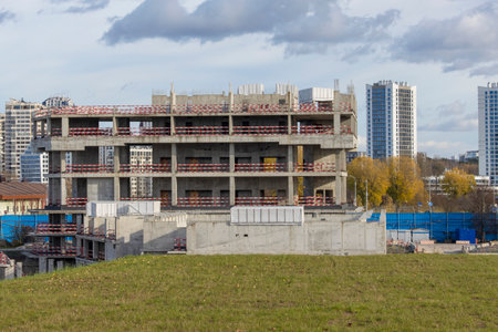 Abandoned construction of a large concrete building. Stopped construction of an office building due to lack of fundingの写真素材