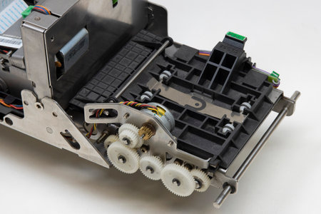 Close-up maintenance and repair of the cash machine bill acceptor mechanismの写真素材