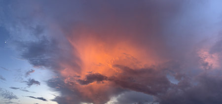 Panoramic view of the evening sky with clouds. Dramatic sunset sky.