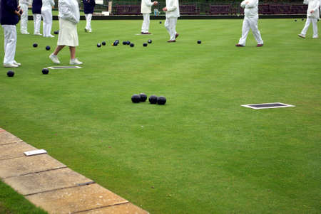 Senior people playing lawn bowlingの写真素材