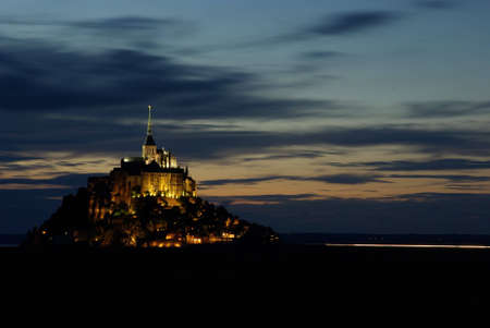 Photo of Mont Saint Michel illuminated at sunset.の写真素材