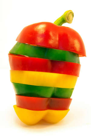Close-up view on sliced pepper over a white backgroundの写真素材