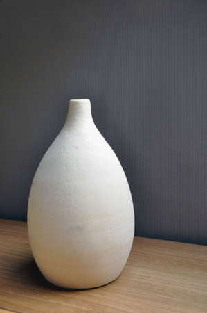 Beige vase in ceramic used as room decoration.の写真素材
