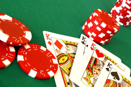Detail view of a lucky poker hand with chips.