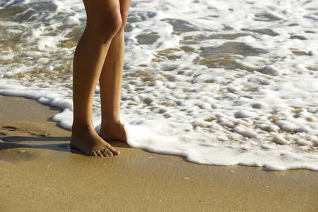 Detail shot of some lady feet on the beachの写真素材