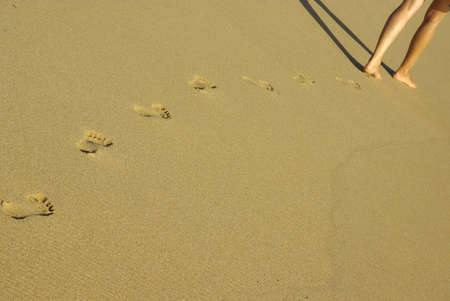 Image of lady fotprints in the sand.の写真素材