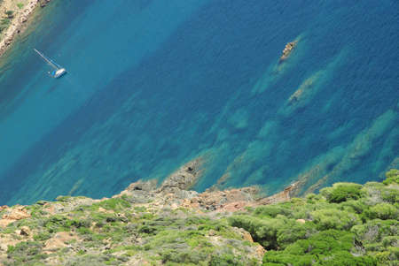 Image of a Mediterranean creek with a sailing boat.の写真素材