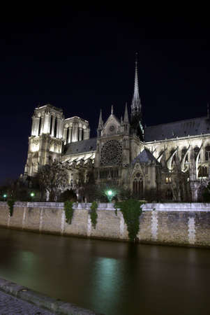 Image of Notre-Dame cathedral and Seine river by nightの写真素材