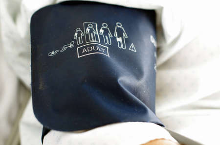 Image of a blood pressure meter cuff on arm の写真素材