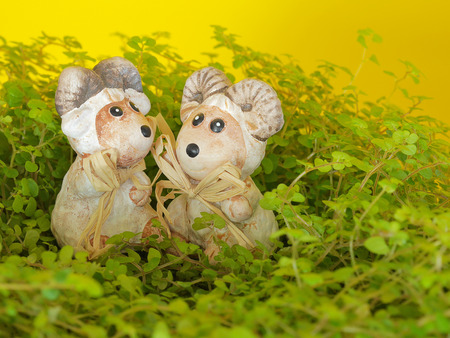 Decorative sheep in the grass. Spring and Easter background.の写真素材