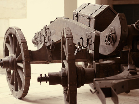 An old wooden carriage with an old chest. Toned style photo.の写真素材