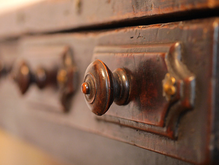 Old archive wooden drawers. Close up view of drawer Handle.の写真素材