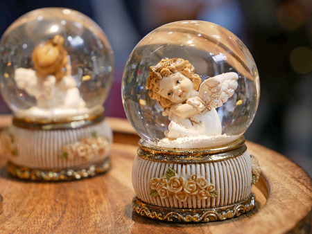 Decorative angel in a glass bulbの写真素材