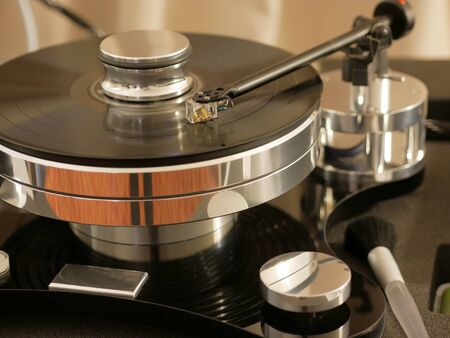 Retro turntable player.Turntables needle on vinyl record disc with music. Audiophile analog audio...