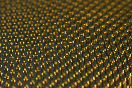 Closeup CPU pins on a green printed circuit board. Golden pins on a green printed circuit board.の写真素材