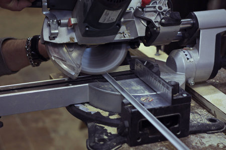 Circular saw. Work with circular saw for metal corner.の写真素材