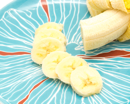 Banana slices on serving plate isolatedの写真素材