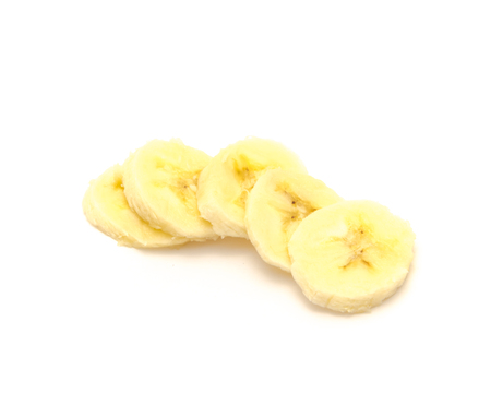 Heap of banana slices isolated on whiteの写真素材