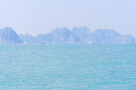 Beautiful Emerald waters and towering limestone at Ha Long bay, Vietnam. Amazing seascape at early morning light.の写真素材