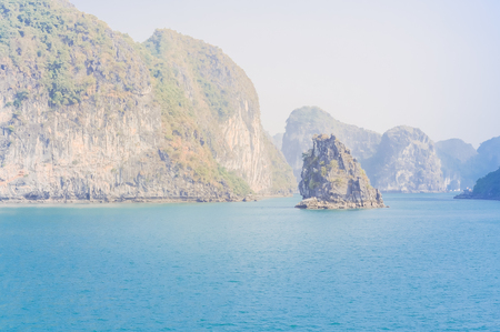 Beautiful Emerald waters and towering limestone at Ha Long bay, Vietnam. Amazing seascape at early morning light.の写真素材