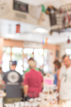 Blurred image line of customers at check-out counter grocery in USA. Concept of busy shoppers waiting at local farmer market. Business concept, bokeh lightの写真素材