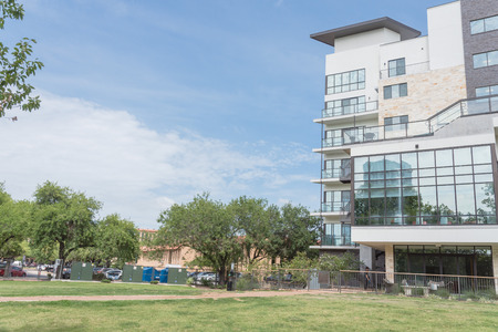 New development apartment building with large grass lawnの写真素材