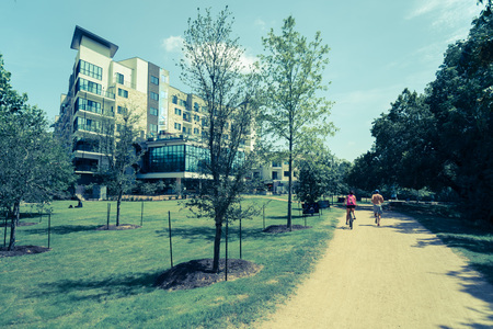 Filtered image healthy people running and biking on natural traiの写真素材