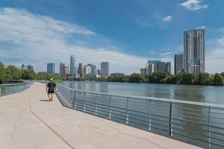 People enjoy outdoor activities on boardwalk in downtown Austinの写真素材